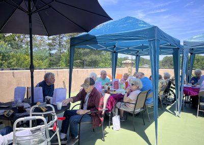 Rooftop lounge with patio gardens and outdoor seating at Monarch House